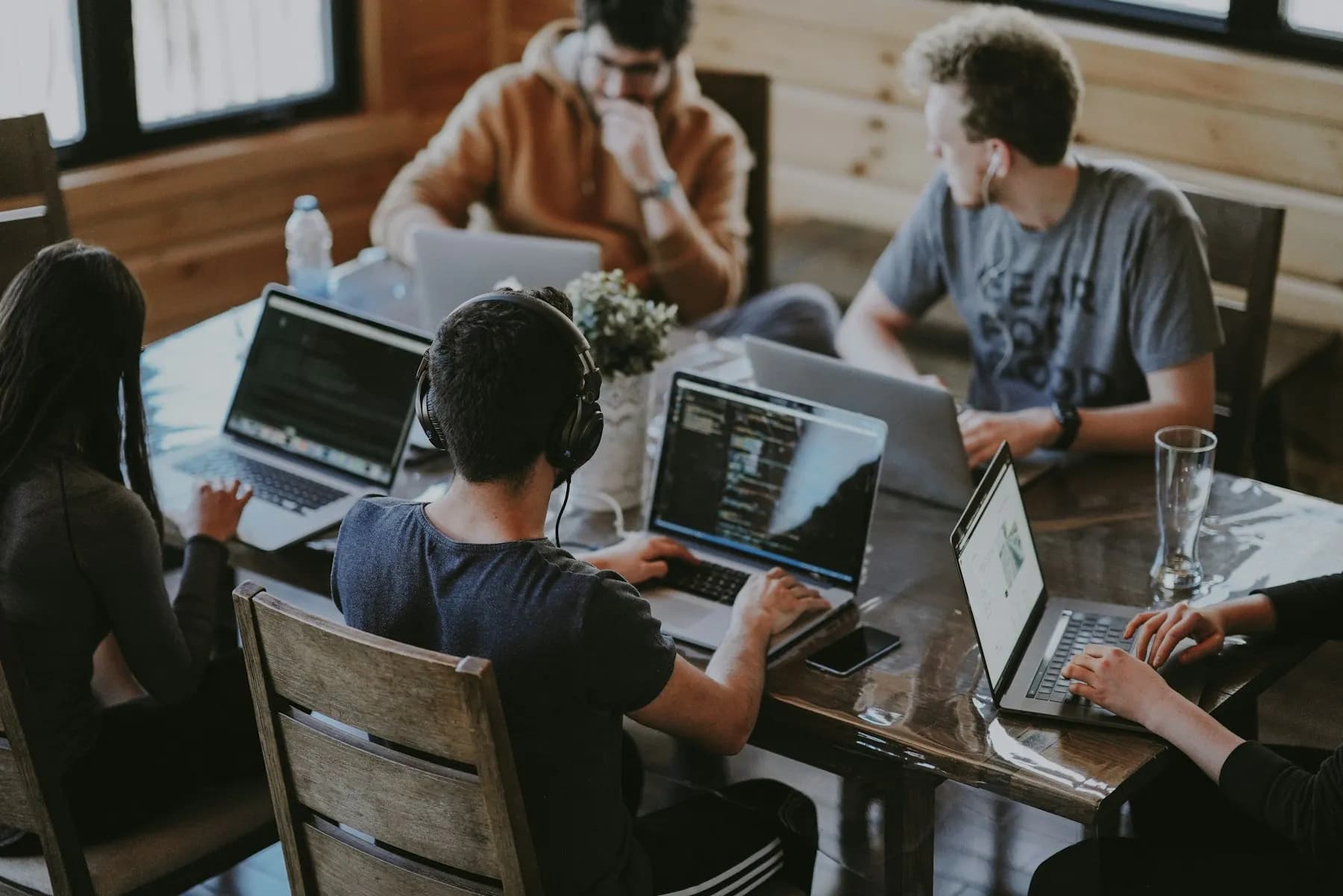 A product team reviewing work together around a studio table
